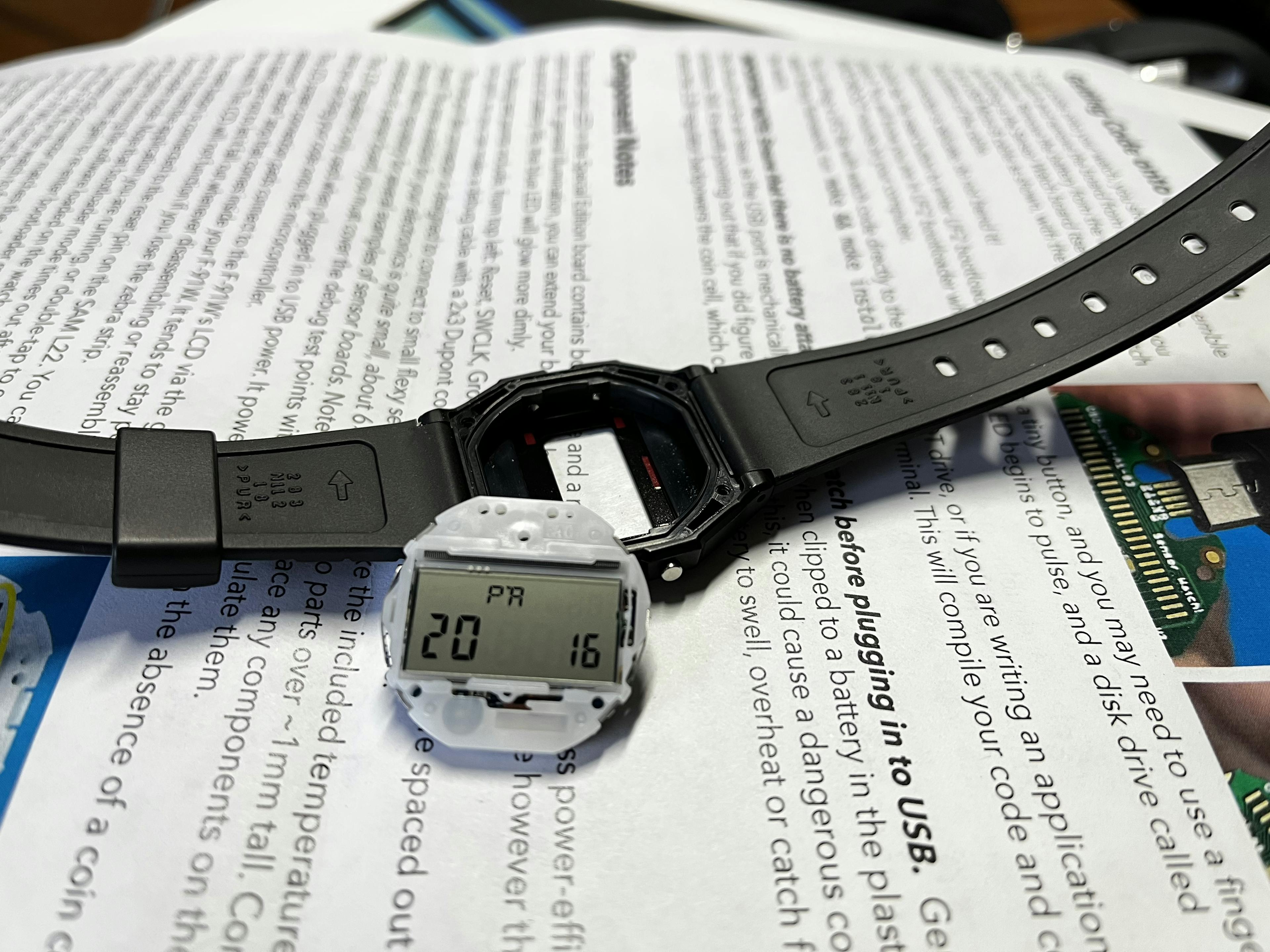 Partially disassembled watch showing a successful probability dice roll.